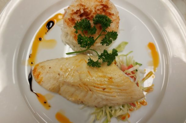 a serving plate of a filet of tilapia