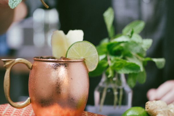 a copper mug with a lime wedge and mint